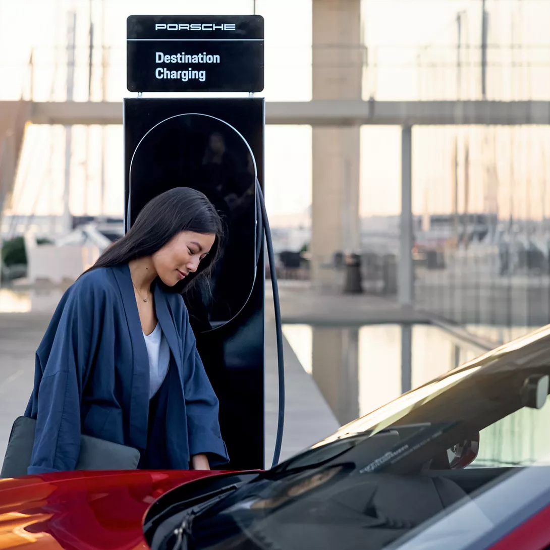 Woman charges her electric car